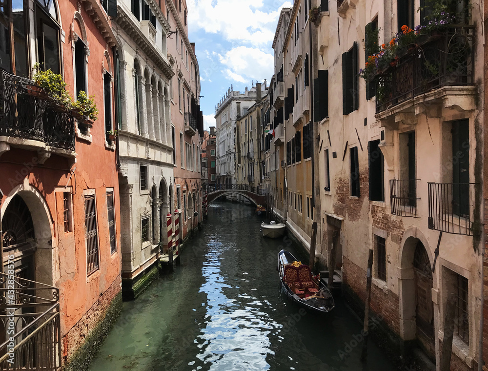 canal and gondola in venice, italy