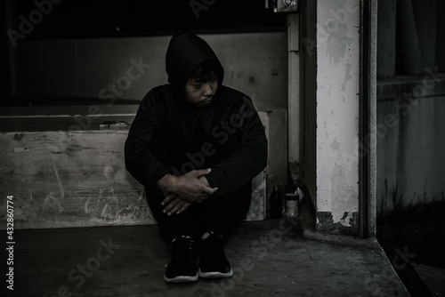 Portrait of asian man sad,drug addict man sitting on the floor,flakka drug,zombie drug