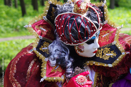 An unidentified person in a carnival costume. TALLINN, ESTONIA MAY 2016: Venetian Carnival