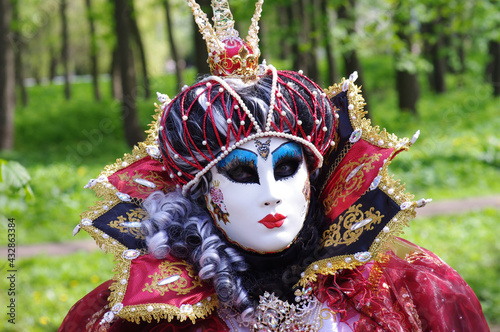 An unidentified person in a carnival costume. TALLINN, ESTONIA MAY 2016: Venetian Carnival
