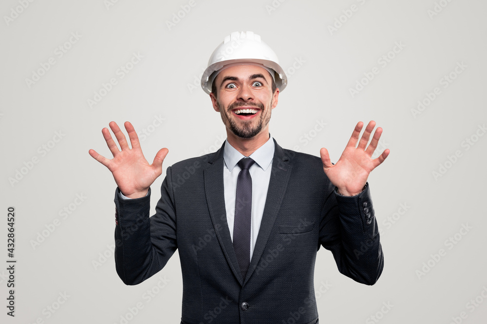Excited engineer in hardhat and suit Excited engineer in hardhat and suit