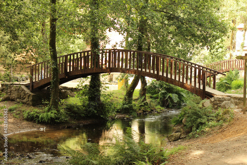 Wooden bridge over the river, next to the nature park of the Barosa river mills.