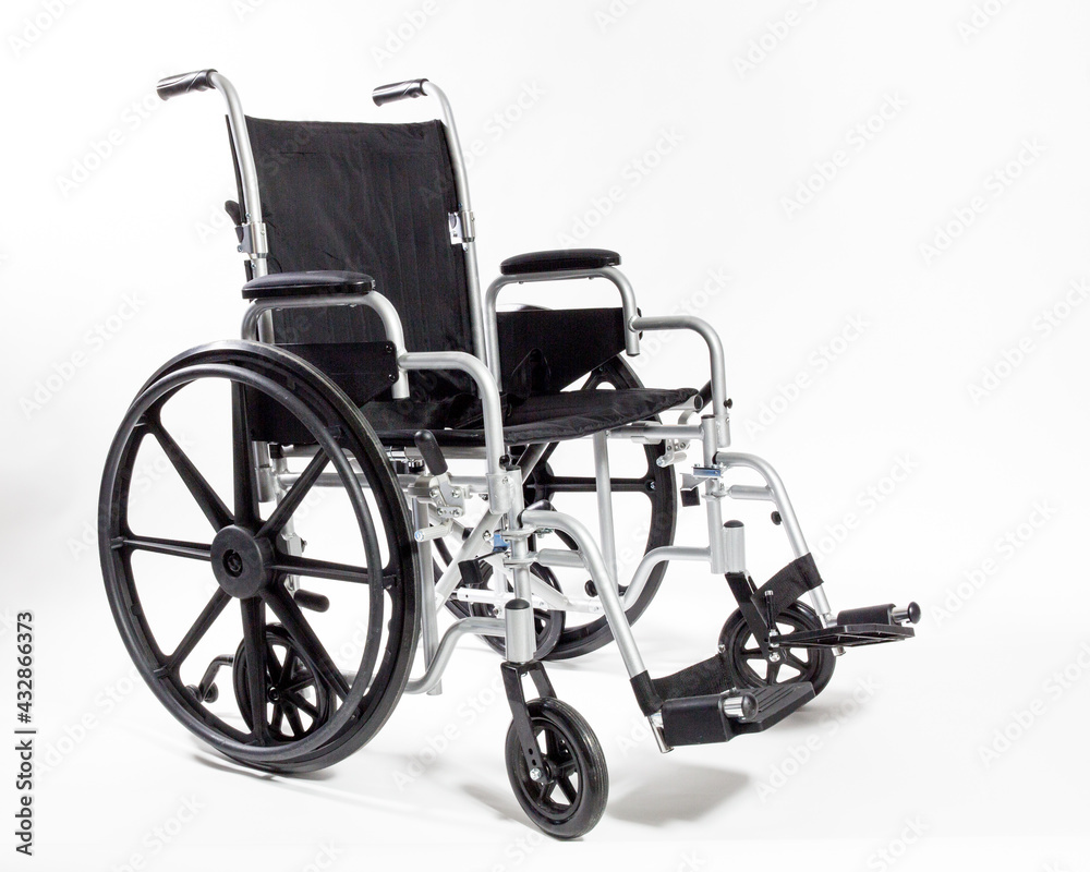 Fototapeta premium An adult size Wheelchair in black isolated on white
