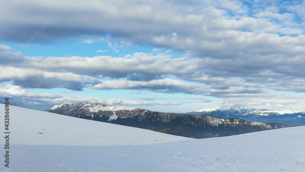 Panning on rocky mountains covered with snow Panning on rocky mountains covered with snow