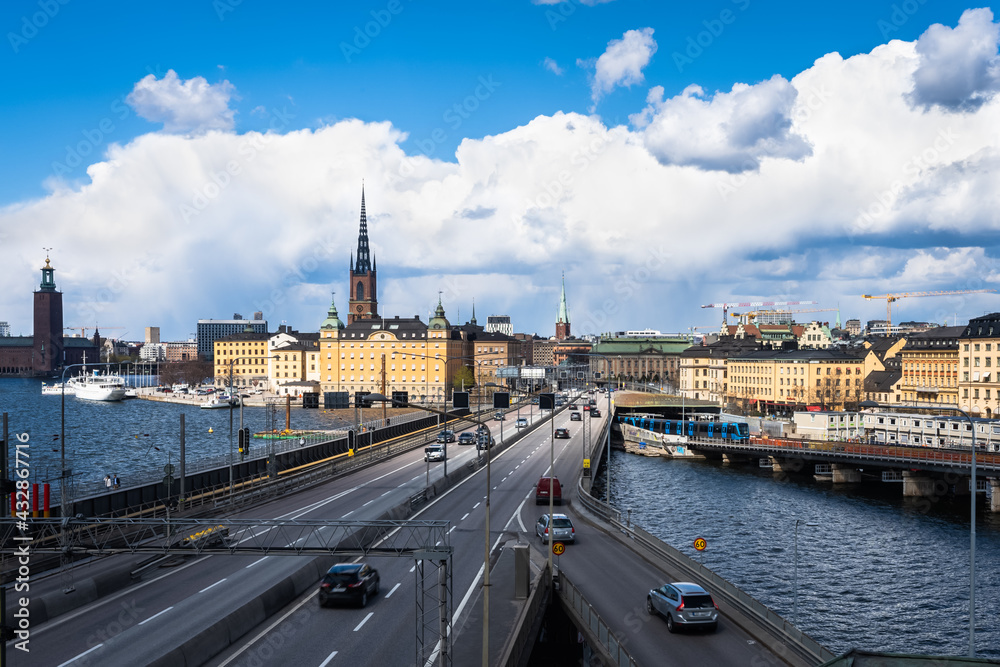 Panoramic view of the center of Stockholm. The metro train moving the Slussen district. Amazing view of the Sodermalm island, The City Hall, Riddarholmen in Gamla Stan.