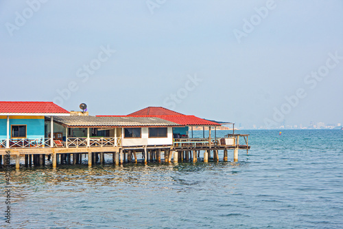 Traditional wooden house on the blue sea