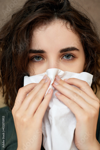 sick girl having influenza symptoms coughing at home