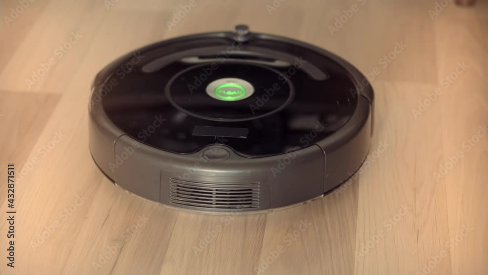 Smart Home Robotic Vacuum Cleaner On Laminate Floor Cleaning Dust.Household Equipment Technology.Smart Housekeeping Housework.Internet Of Things.Automatic Robot Vacuum Cleaner Cleaning Floor On Home. Smart Home Robotic Vacuum Cleaner On Laminate Floor Cleaning Dust.Household Equipment Technology.Smart Housekeeping Housework.Internet Of Things.Automatic Robot Vacuum Cleaner Cleaning Floor On Home.