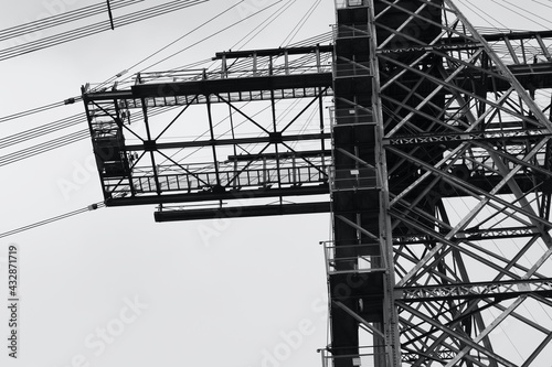 Newport Transporter Bridge, constructed in 1902 crosses the River Usk in Newport and is a grade 1 listed structure with cantilevered sections, the main girder truss gives it an overall length of 232m photo