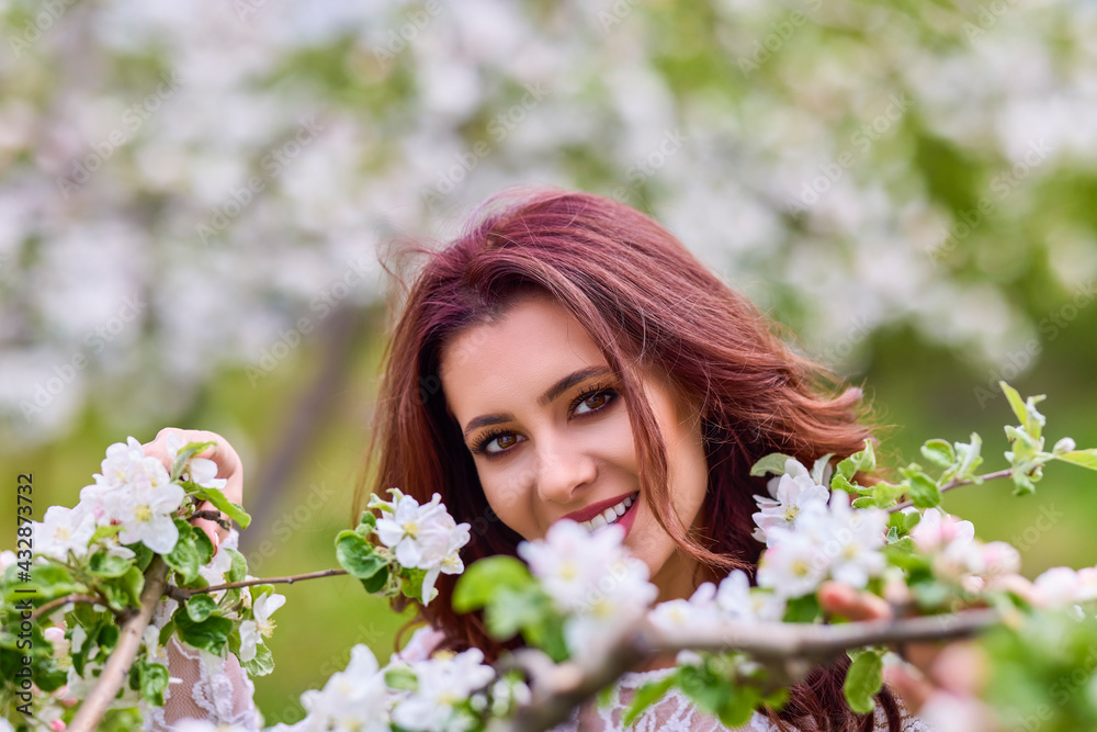 Beautiful natural woman in the garden of apple Beautiful natural woman in the garden of apple