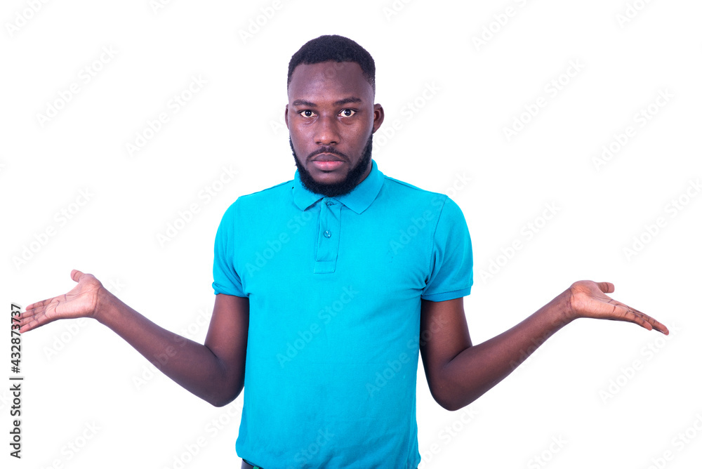 young man with confused expression raising arms and hands. young man with confused expression raising arms and hands.