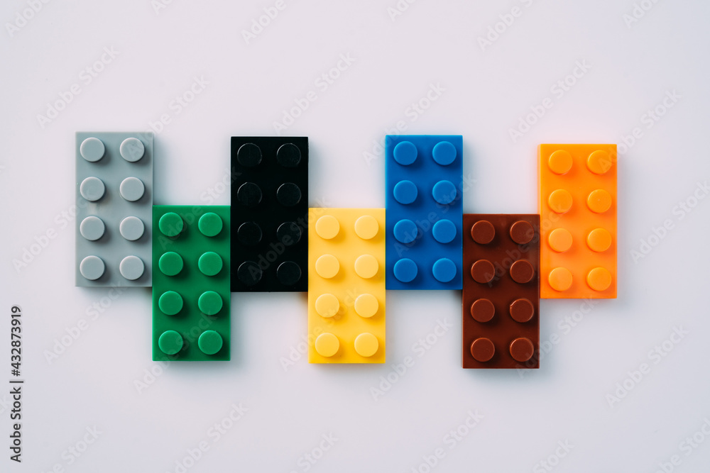 Plastic building blocks on white background