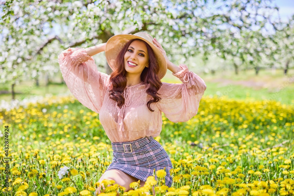 Beautiful natural woman in the garden of apple Beautiful natural woman in the garden of apple
