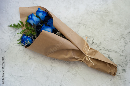 half dozen blue roses in isolated background
