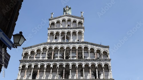 Walking through POV shot towards the San Michele in Foro Church in the medieval town of Lucca, Tuscany, Italy. Point of view. 