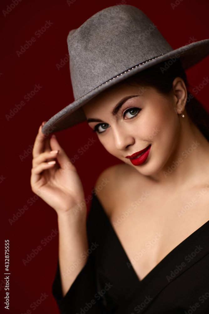 portrait of fashionable beautiful girl on red bakground. portrait of fashionable beautiful girl on red bakground.