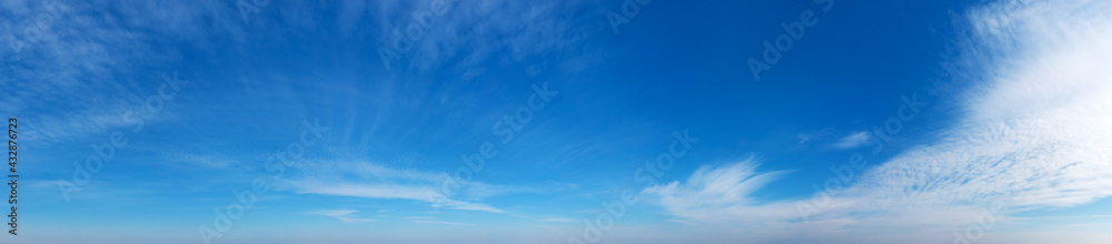 Blue Sky background with tiny Clouds. Panorama background Blue Sky background with tiny Clouds. Panorama background