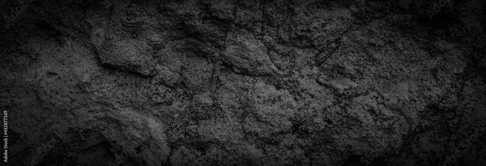 black limestone rock with visible details. background or texture Stock