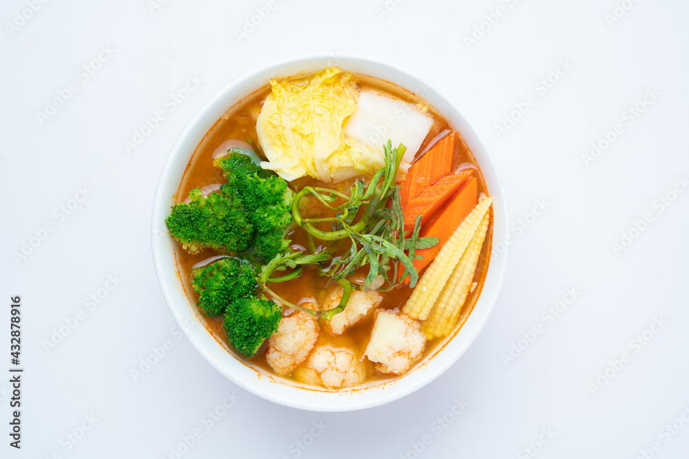 Mixed Vegetable in Sour soup made of Tamarind Paste with Shrimps and Vegetable Omelet - Asian food style or Thai food style isolated on white background Mixed Vegetable in Sour soup made of Tamarind Paste with Shrimps and Vegetable Omelet - Asian food style or Thai food style isolated on white background