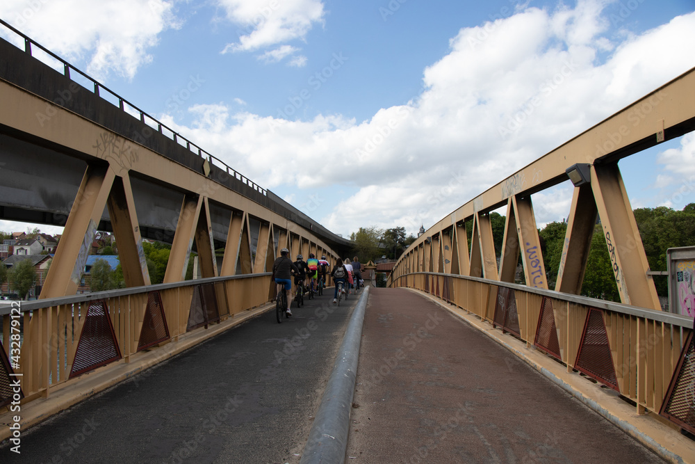 Spring views of Conflans-Fin-D'Oise, the footbridge over the river Seine