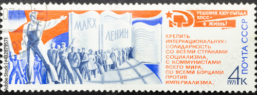 Postage stamp 'Procession of workers'. Series: 'Resolutions of 24th Communist Party Congress' by artists Y. Levinovsky, A. Schmidstein, 1971 photo