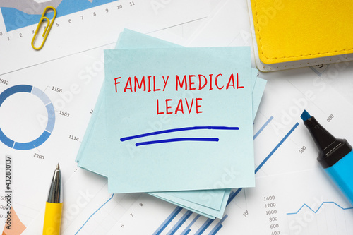  FAMILY MEDICAL LEAVE phrase on the piece of paper. photo