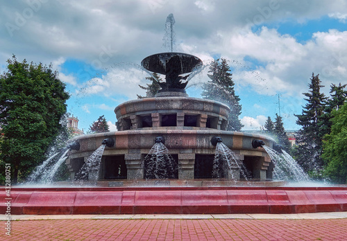 Fountains in sunset  campus of famous Moscow university under cloudy sky in spring