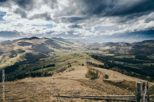 A field with a mountain in the background