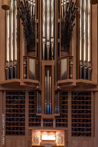 Fragment of big organ at the Moscow House of Music, register with different pipes from metal, musical instrument, selected focus, vertical photo © lusyaya