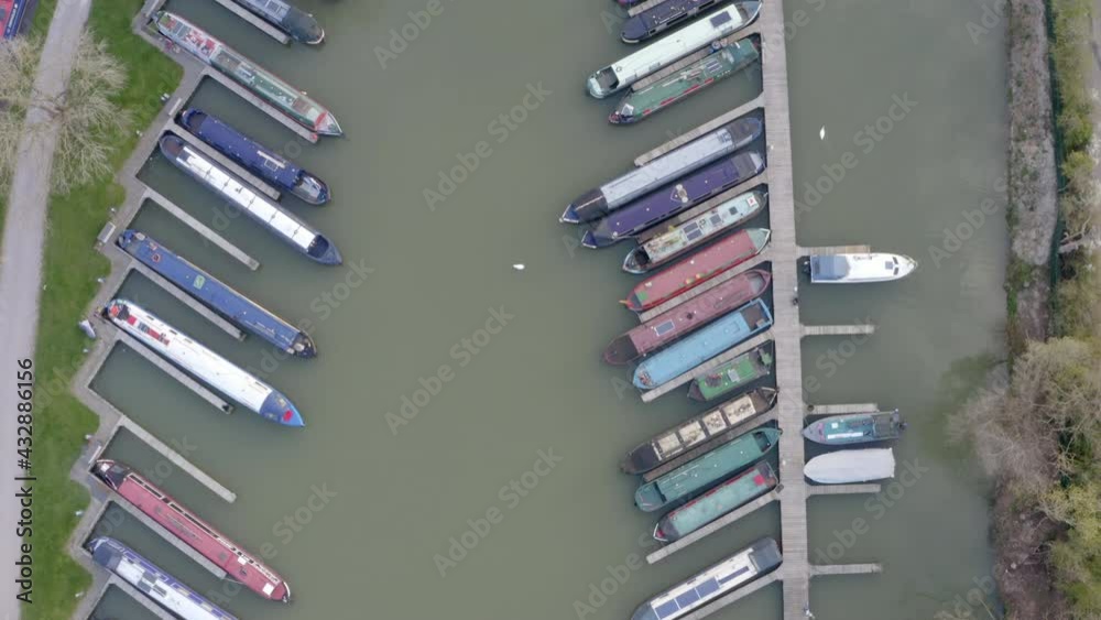 Aerial shot of narrow boats in the marina from directly above Aerial shot of narrow boats in the marina from directly above