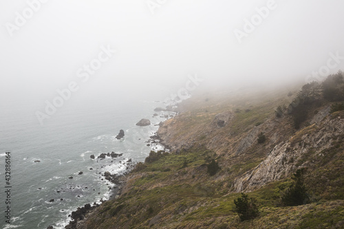 Aerial shot of the cliffs and the ocean captured in Muir Beach, California, USA photo