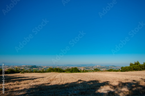 Beautiful sunrise in the countryside of Marche in a summer morning