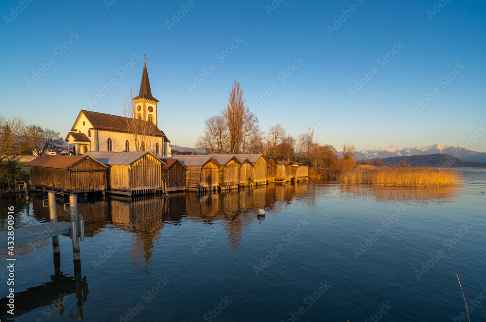 Beautiful scenery along of small harbor of the idyllic lakeside village of Busskirch, Rapperswil-Jona, St. Galen, Switzerland