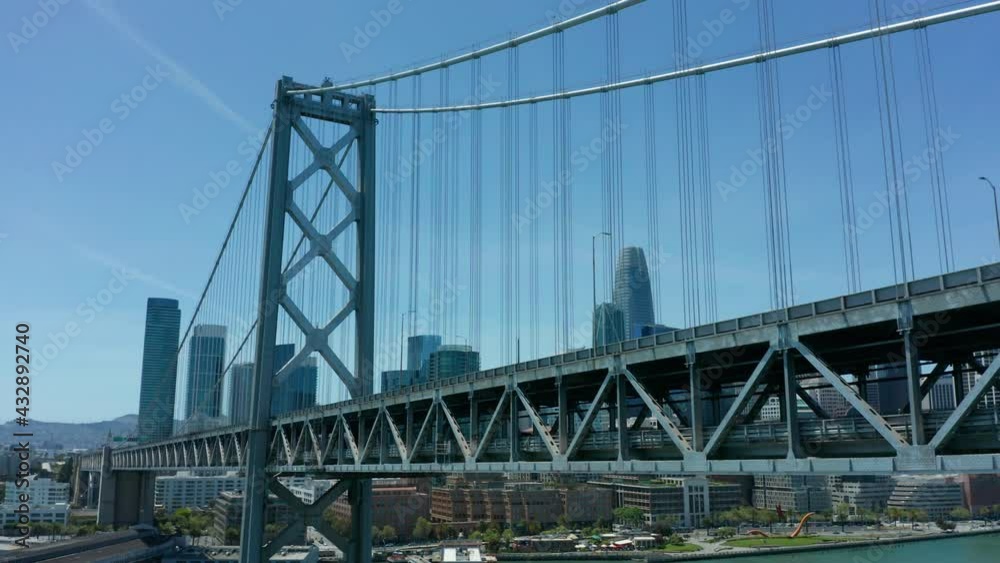 rising and tilting down shot of Oakland Bay Bridge with San Francisco in Bkrd rising and tilting down shot of Oakland Bay Bridge with San Francisco in Bkrd