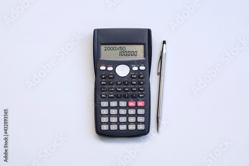 Office desk table with calculator, pen