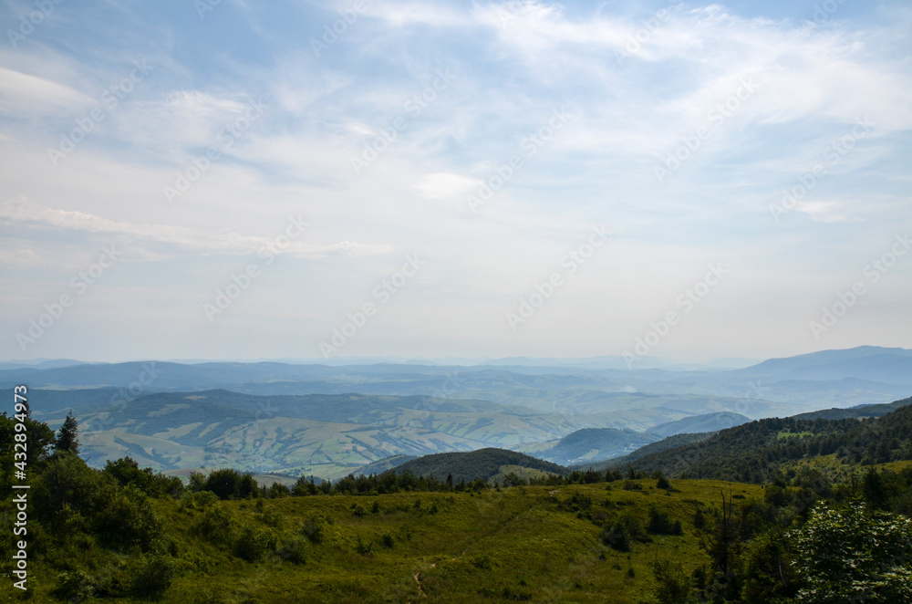 View from above of the hills mountains and fir trees home buildings in the village in summer season Carpathian mountains, Ukraine View from above of the hills mountains and fir trees home buildings in the village in summer season Carpathian mountains, Ukraine