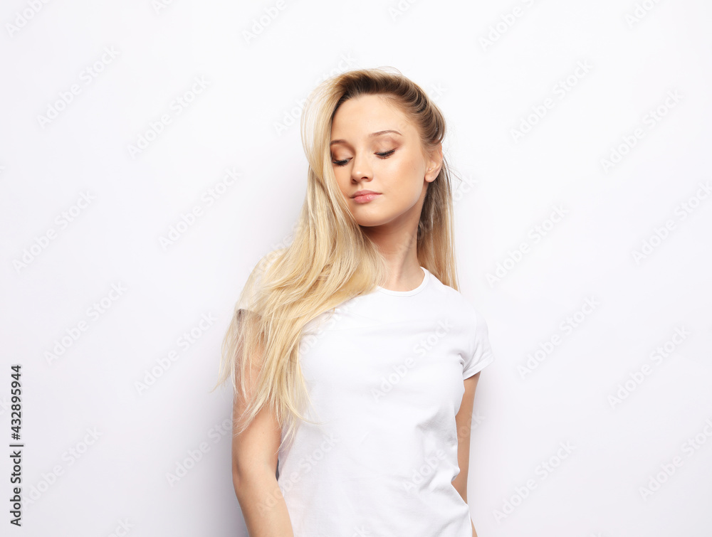 Portrait of a beautiful woman dressed casual with a long blond hair Portrait of a beautiful woman dressed casual with a long blond hair