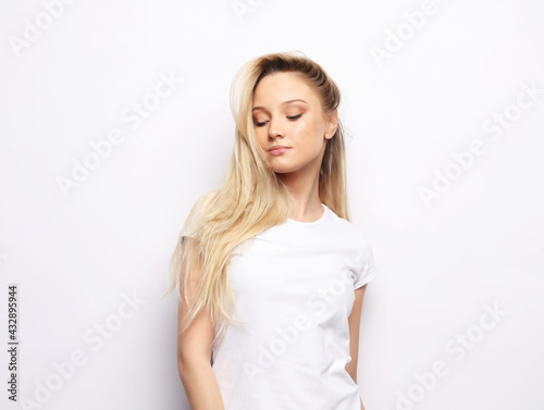 Portrait of a beautiful woman dressed casual with a long blond hair