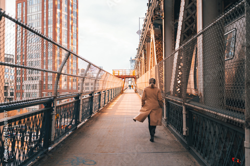 Photography person walking on bridge woman New York