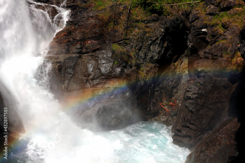Waterfall of Lillaz in the Alps mountains with rainbow