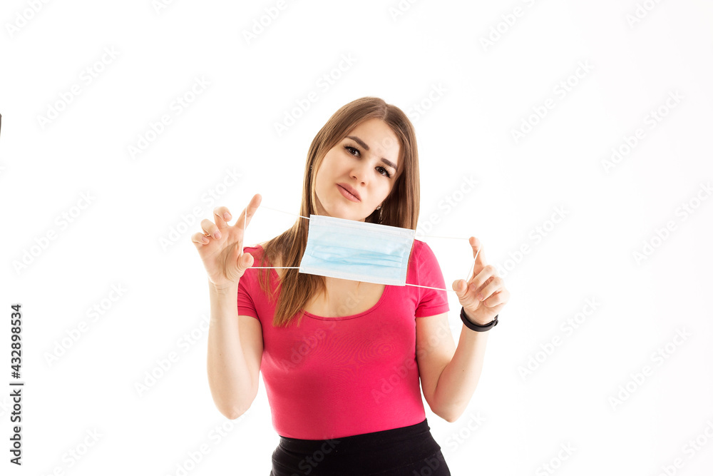 young woman holding a mask quarantine coronavirus young woman holding a mask quarantine coronavirus