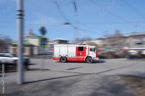 Novokuznetsk,Russia-23.04.2021.A fire truck rushes at high speed to the fire
