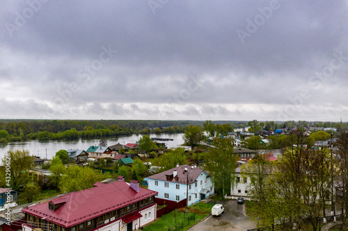 a panoramic view of the river and the historic center of Gorokhovets during the rain filmed from a drone 