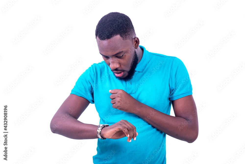 portrait of a young man looking at watch, surprised. portrait of a young man looking at watch, surprised.