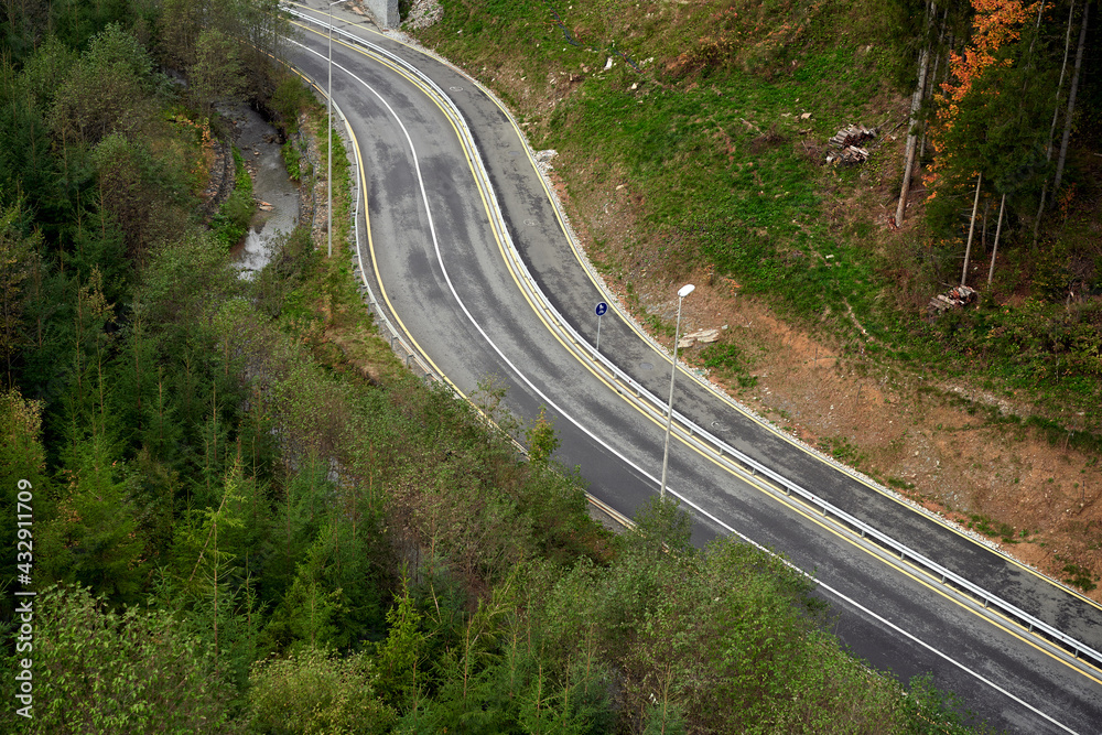 Mountain road Aerial view of road through forest