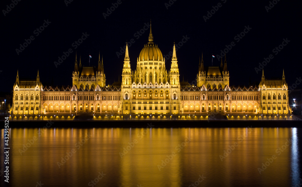 Hungarian Parliament by the river Danube at night.  