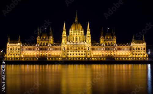 Hungarian Parliament by the river Danube at night. 