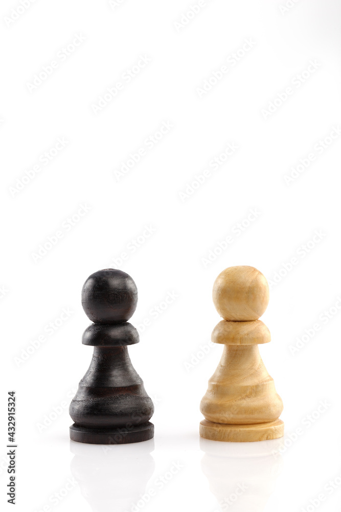 Two chess pawn are standing next to each other, isolated on a white background. Close-up. Two chess pawn are standing next to each other, isolated on a white background. Close-up.