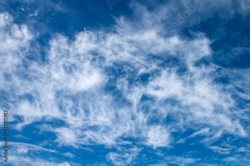 beautiful blue sky with white cirrus clouds as a natural background