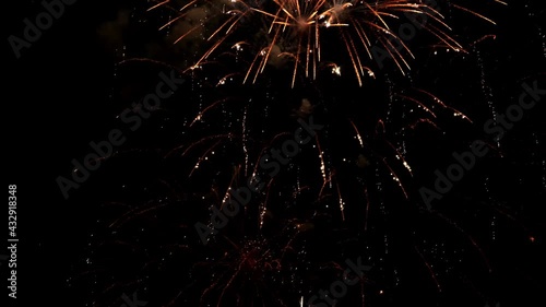 shining fireworks with bokeh lights in night sky. glowing fireworks show. New year's eve fireworks celebration. multicolored fireworks in night sky. beautiful colored night explosions in black sky. 